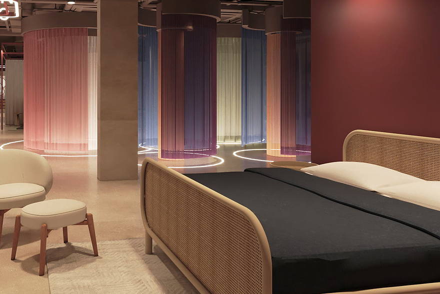 Curtain fabrics hung in coloured cylinders beside a cane bed frame.