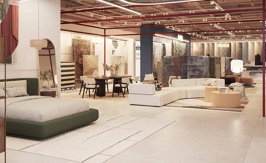 A furniture floor with sofas, dining settings and rugs under an open ceiling.